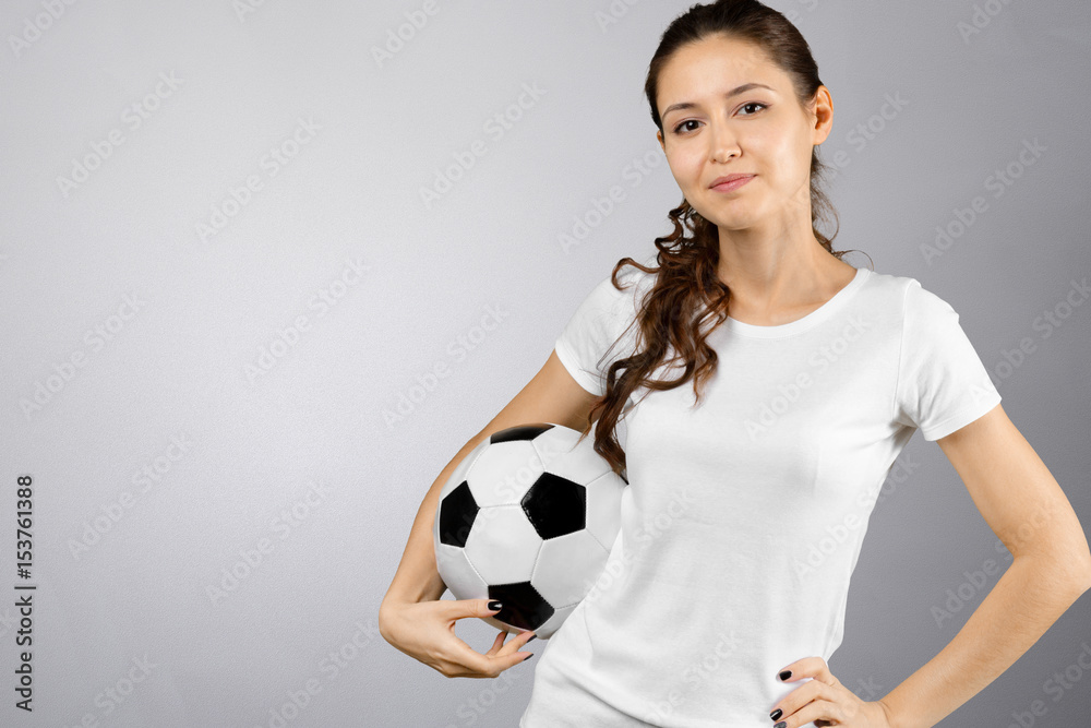 young woman holding soccer ball on her hand young woman holding soccer ball on her hand