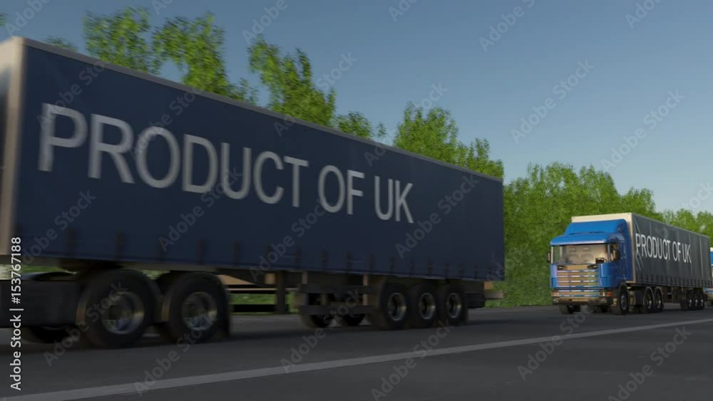 Moving freight semi trucks with PRODUCT OF UK caption on the trailer. Road cargo transportation. Seamless loop 4K clip Moving freight semi trucks with PRODUCT OF UK caption on the trailer. Road cargo transportation. Seamless loop 4K clip