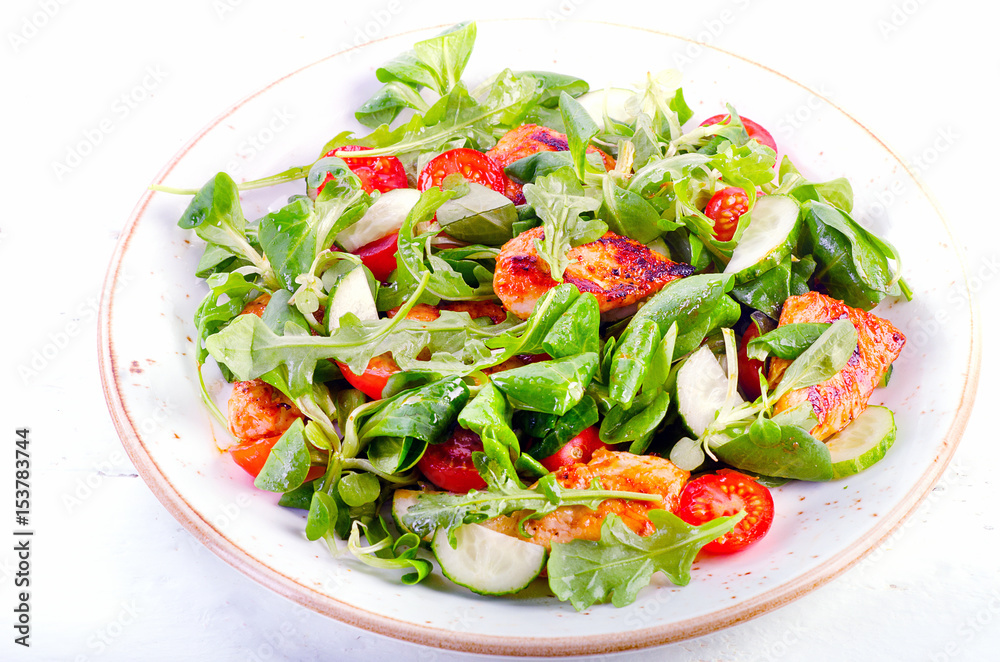 Healthy salad with chicken breast, cucumber and tomato Healthy salad with chicken breast, cucumber and tomato