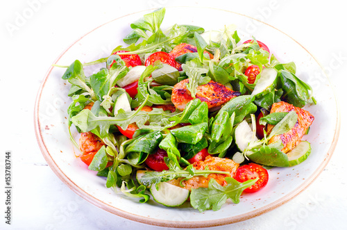 Healthy salad with chicken breast, cucumber  and tomato