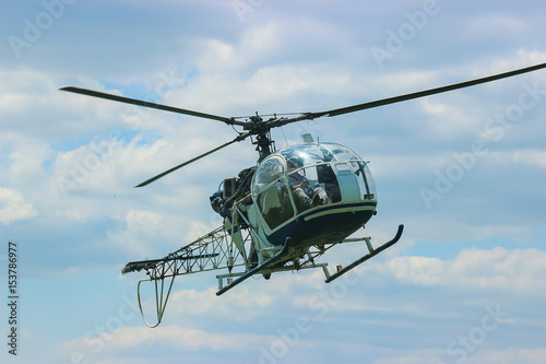 Fototapeta Naklejka Na Ścianę i Meble -  helicopter fly near the forest