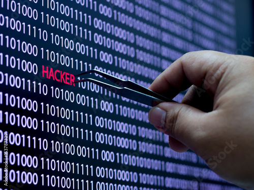 Computer screen shot with binary code and hacker text, great concept for technology computer and online security