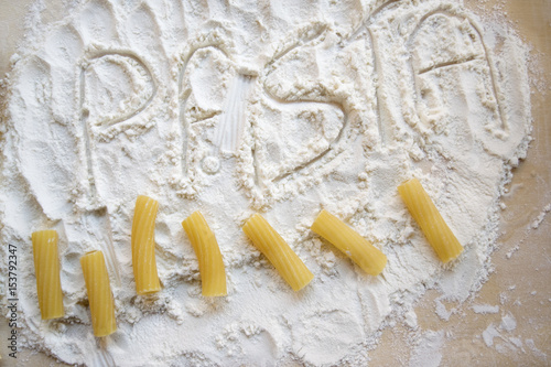 the word pasta written with the flour