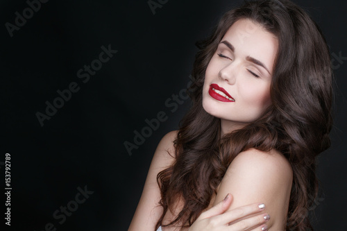 Calming dreams. Studio portrait of a stunning relaxed model posing on black background.