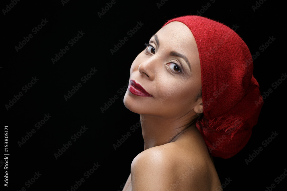 African beauty. Gorgeous African woman looking to the camera smiling against black background African beauty. Gorgeous African woman looking to the camera smiling against black background