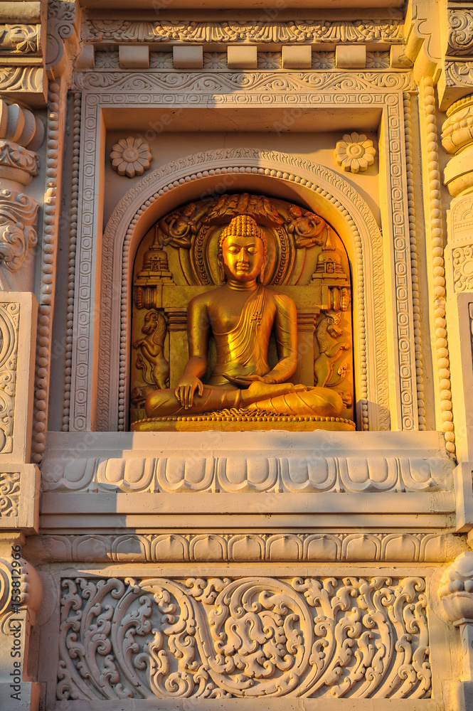 Golden Buddha Image with traditional Thai art