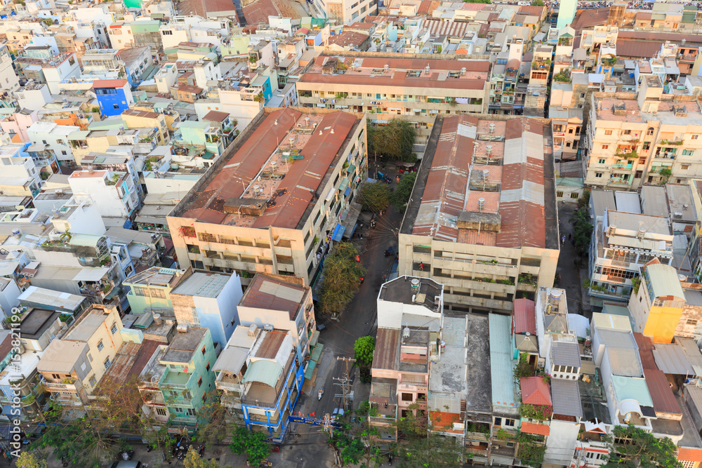 Fototapeta premium Ho Chi Minh city scape in Vo Van Kiet boulevard, canal, buildings and traffic around Cau Chu Y bridge, district 8