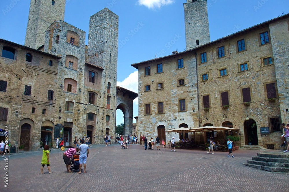 Famous Piazza della Cisterna in the historic town of San Gimignano, Tuscany, Italy