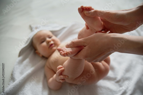 Baby feet which mother keeps in her hands