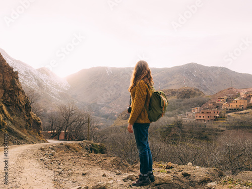 Female tourist with backpack photo