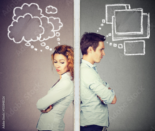 Картината върху платно Angry couple thoughtful man and woman separated by wall