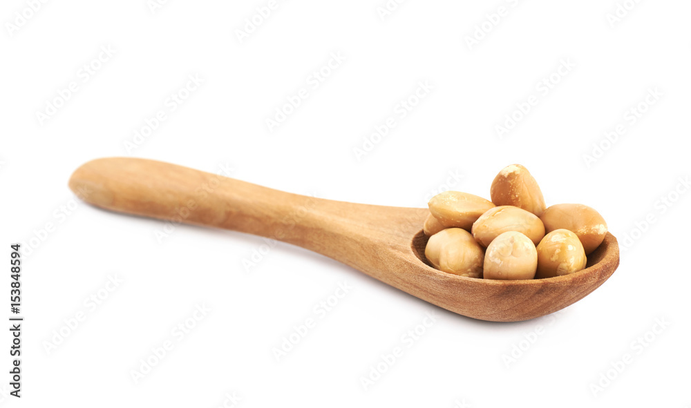 Spoon full of peanuts isolated
