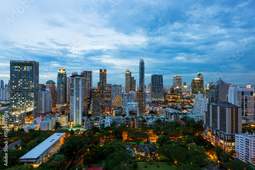 Aerial view of Bangkok City skyline at sunset with skyscrapers of midtown bangkok, Thailand.