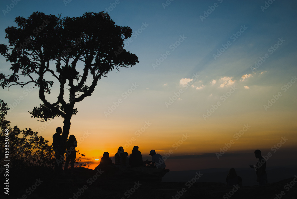 People silhouettes at sunset in Brazil