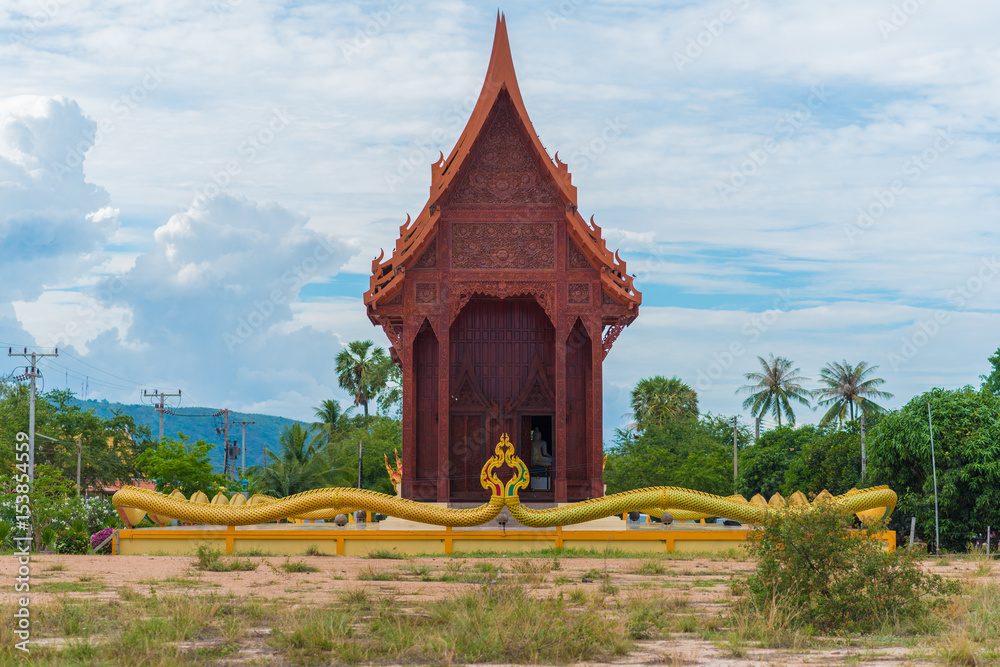 Obraz premium Ao Noi teak wood temple. Carved wood exterior of Wat Tham Phra Buddhist temple near Prachuap Khiri Khan City of Thailand