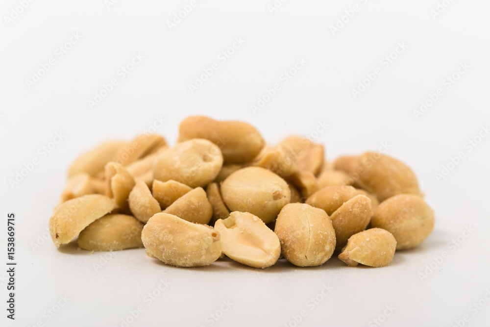 Fried salted peanuts on white background. snack. Fried salted peanuts on white background. snack.