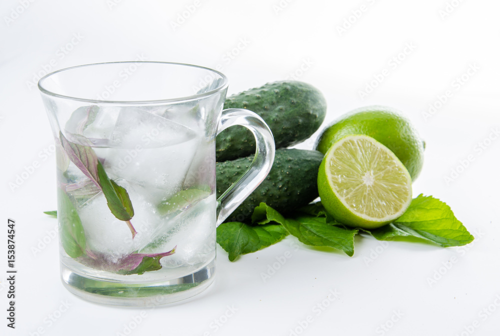 Fresh lemonade. Cucumbers lime ginger and green leaves Fresh lemonade. Cucumbers lime ginger and green leaves