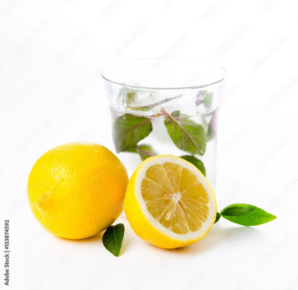Fresh lemonade. Orange and green leaves