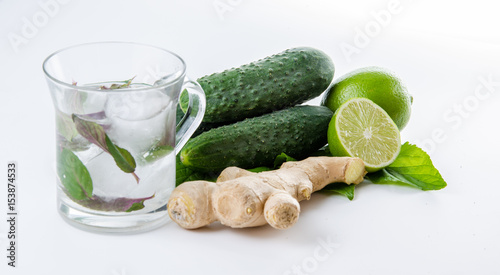 Fresh lemonade. Cucumbers lime ginger and green leaves