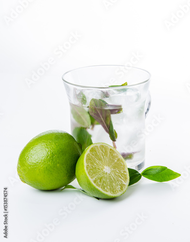 Fresh lemonade. Lime and green leaves