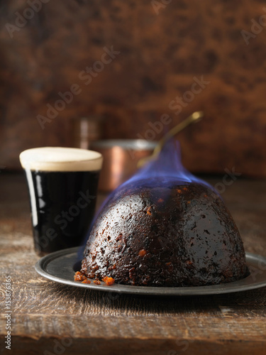 Flaming Christmas pudding with port photo