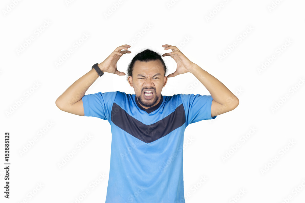 Afro man feels headache on studio Afro man feels headache on studio