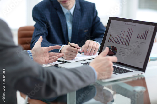 Group of business people busy discussing financial matter during