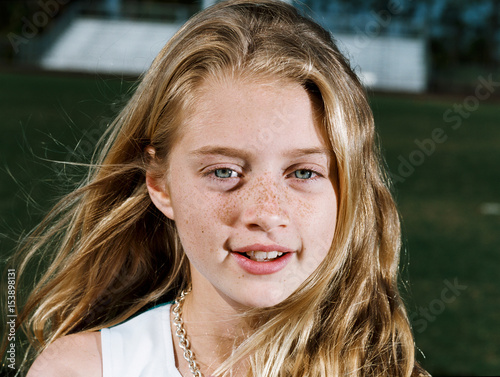 Girl smiling outdoors, portrait