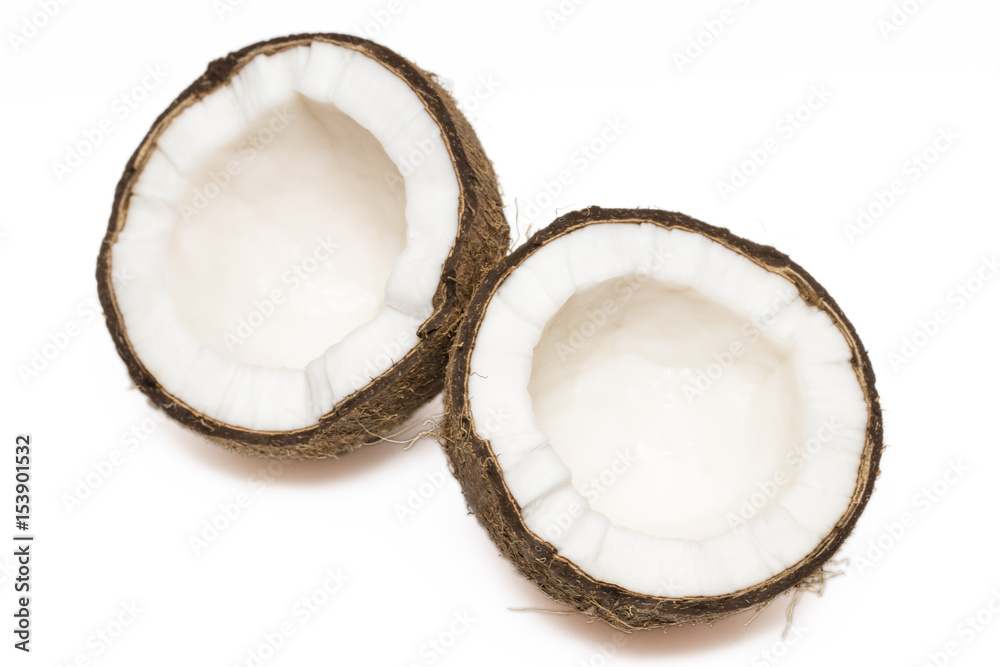 Coconut with a half on white background, closeup Coconut with a half on white background, closeup