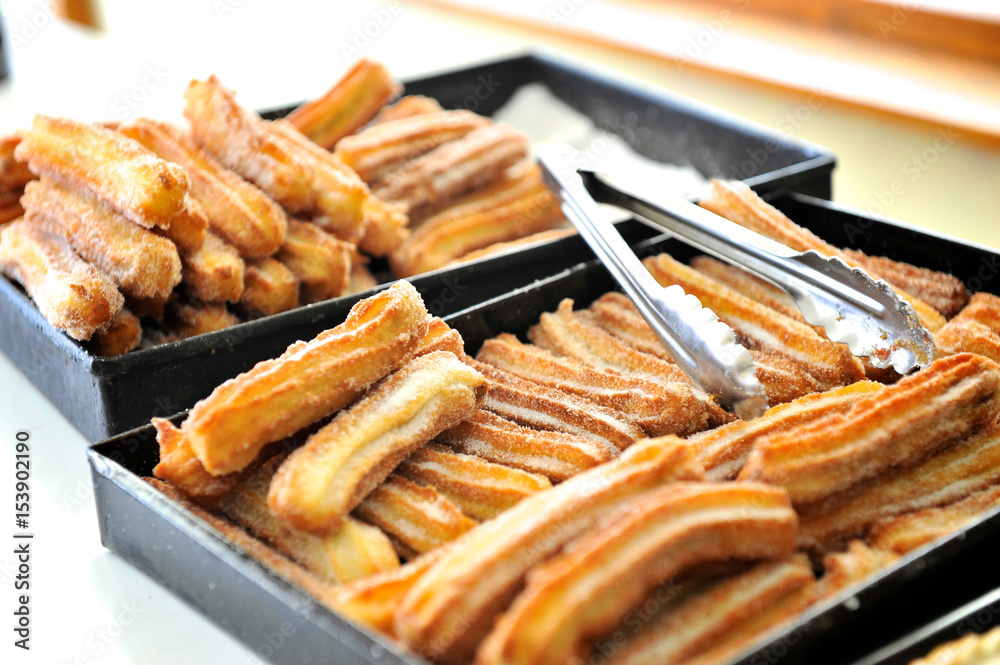 Churros filled with dulce de leche in panaderia, El Chalten, Argentina Churros filled with dulce de leche in panaderia, El Chalten, Argentina