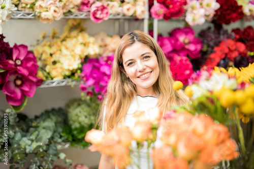 Cute young woman buying some flowers