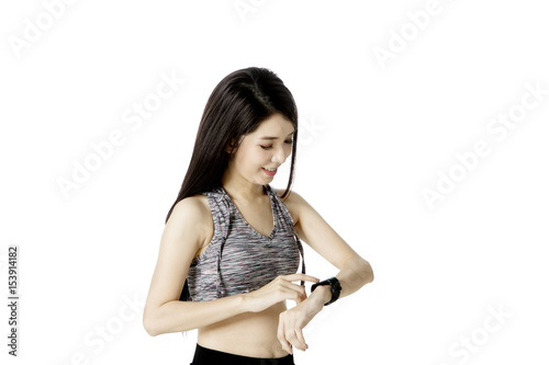 Pretty female with smartwatch on studio