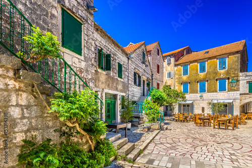 Mediterranean town Hvar island. / Colorful stone architecture at 2400 years old square in old town Stari Grad (Pharos) Island Hvar scenery, Croatia. photo