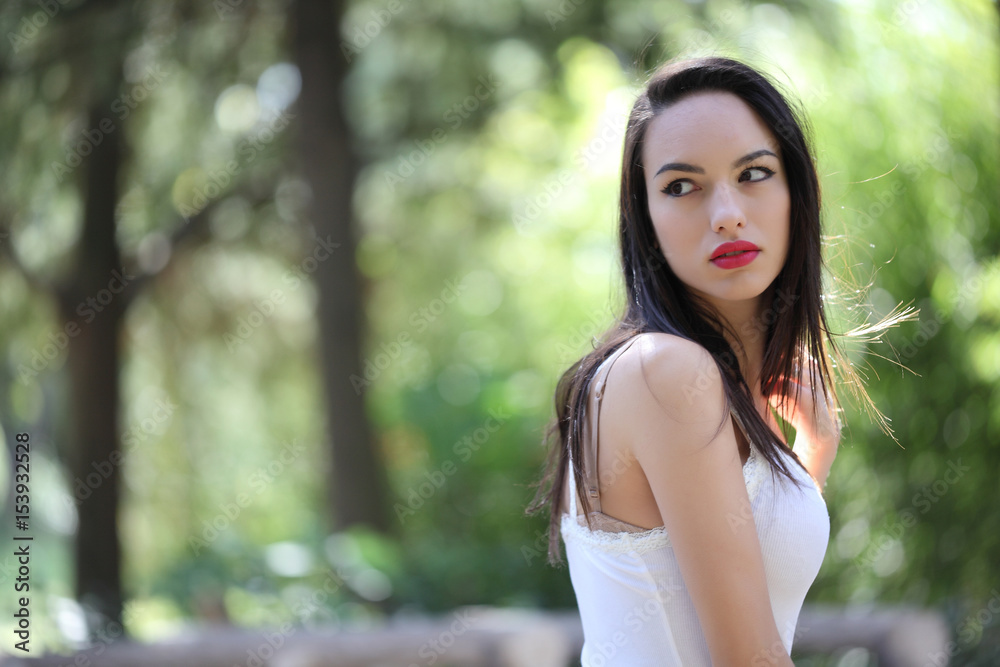 Sensual young woman portrait outdoors in a park Sensual young woman portrait outdoors in a park