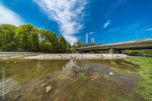 Naherholungsgebiet Isarauen bei München mit Brudermühlbrücke und Heizkraftwerk Süd im Hintergrund photo