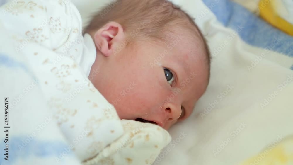 newborn baby lying in the box with open eyes newborn baby lying in the box with open eyes
