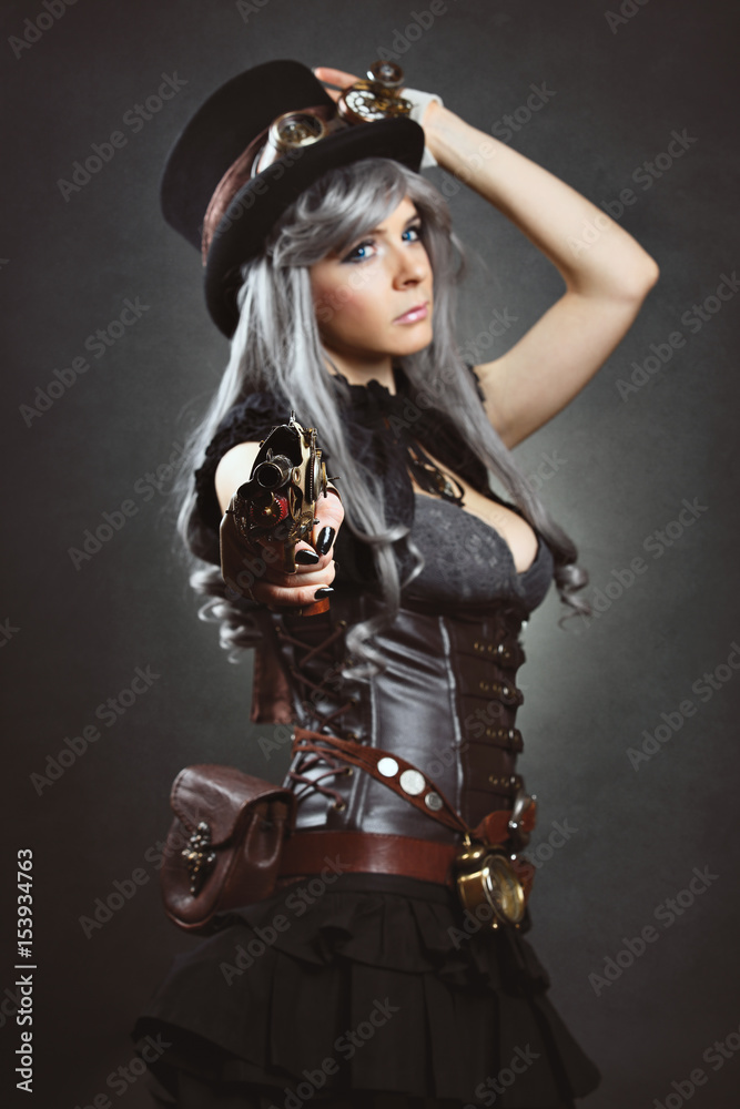 Steampunk woman aiming with gun