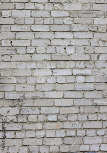 Old worn old brick wall in grunge style, The textured background. Photo pattern.