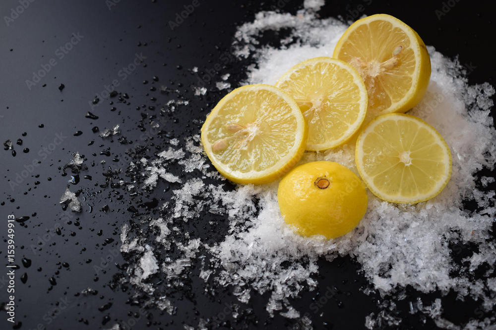 lemon with ice isolated on black lemon with ice isolated on black