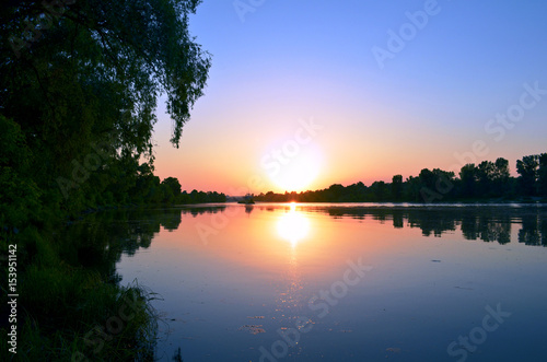 Fototapeta Naklejka Na Ścianę i Meble -  Pure sunset over the lake