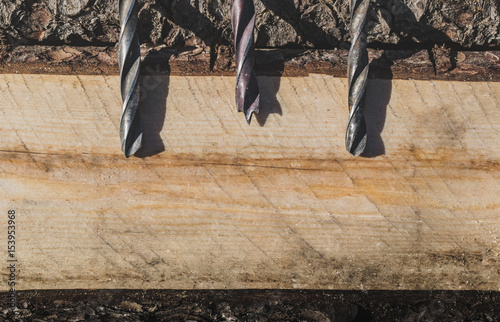 Drills on the background of wood