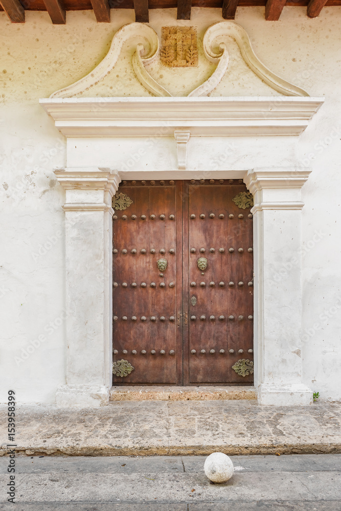 Historic, colonial entrance door with knocker in Cartagena, Colombia