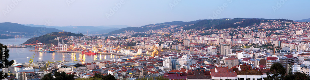 panoramic view of Vigo city in Spain at sunset with illumination