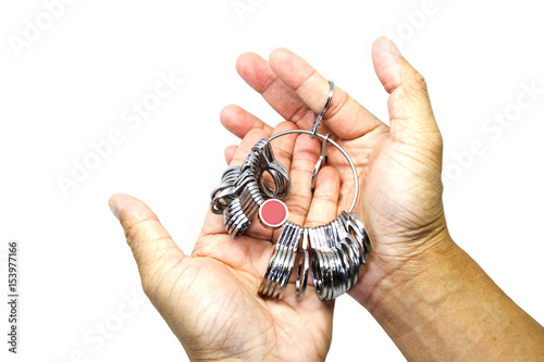 Jeweler finger sizing tool in hand isolated on white background. 