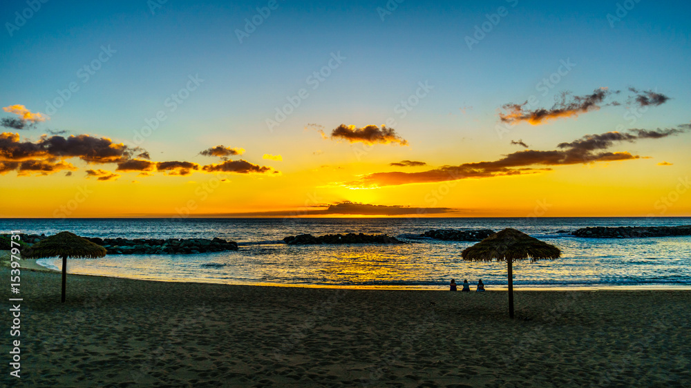 Sunset over the Lagoon and beach with Palm trees and colorful sky at the resort community of Ko Olina on the West Coast of the Hawaiian island of Oahu Sunset over the Lagoon and beach with Palm trees and colorful sky at the resort community of Ko Olina on the West Coast of the Hawaiian island of Oahu