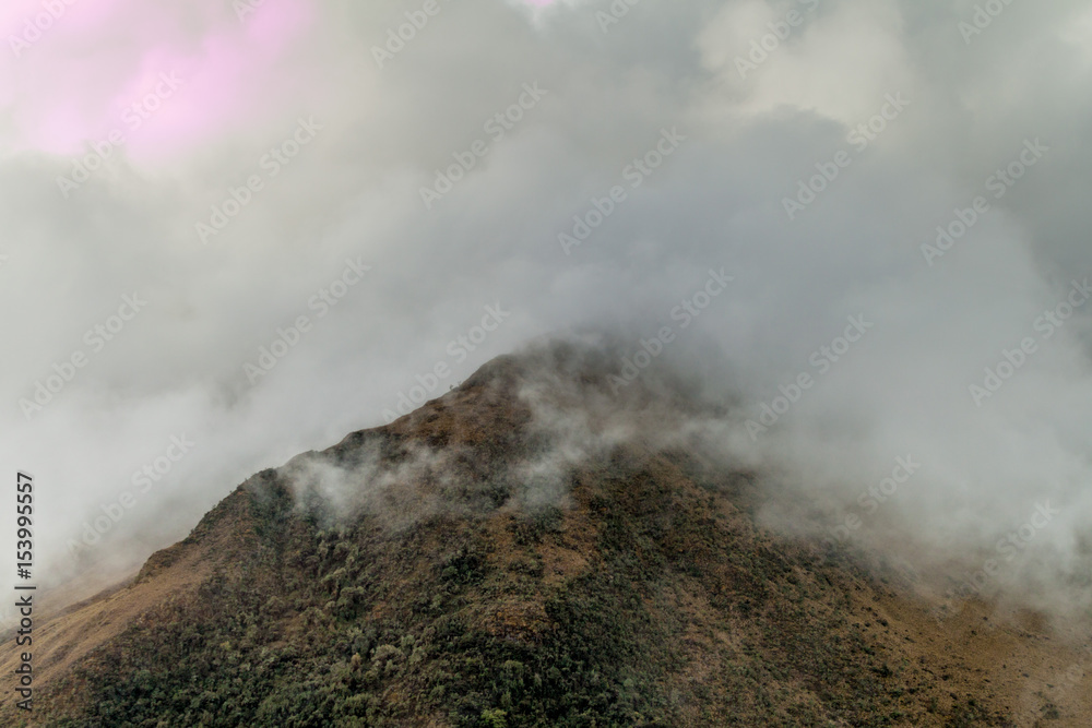 Mountains covered by clouds in Yanamanchi valley, Peru