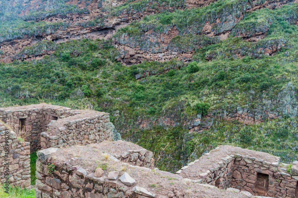 Ancient Inca's ruins Plundered Inca tombs in the background near Pisac ...