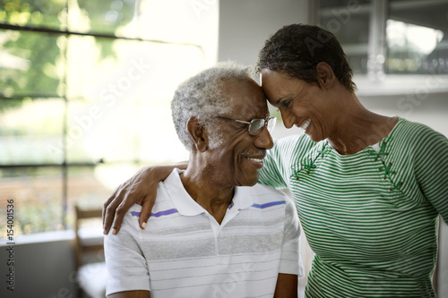 Smiling father and daughter at home