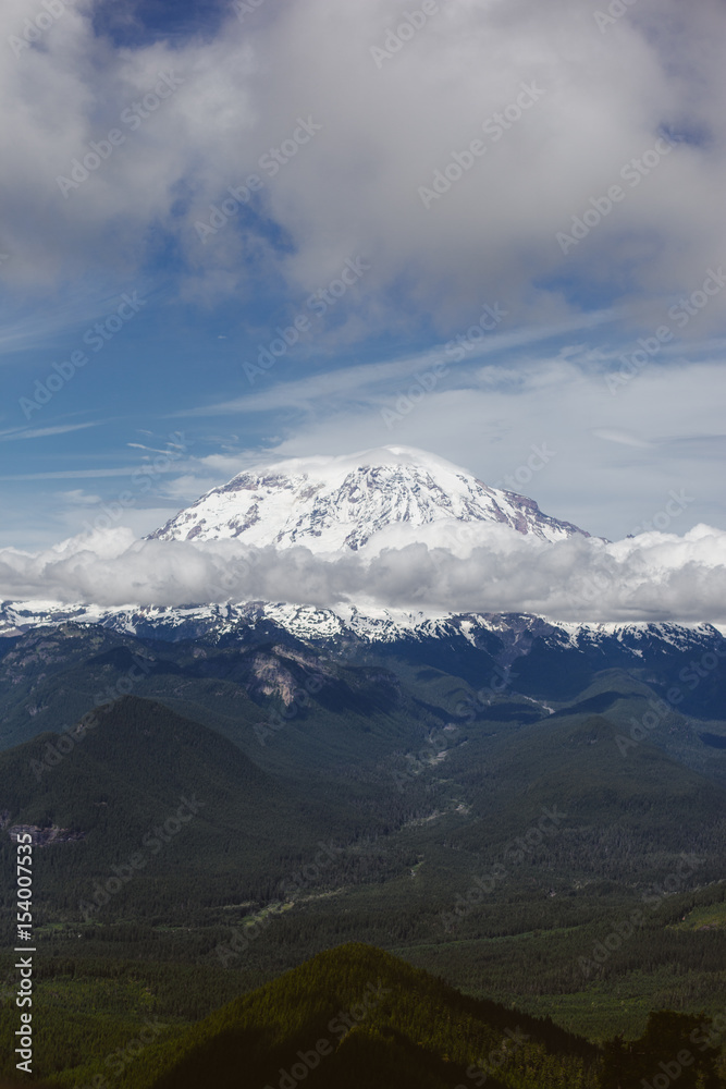 Mount Rainier on a sunny day with clouds Mount Rainier on a sunny day with clouds