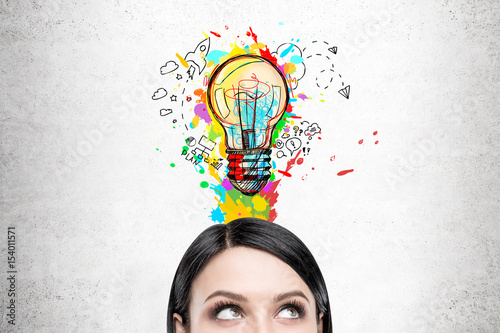 Woman with black hair and colorful light bulb